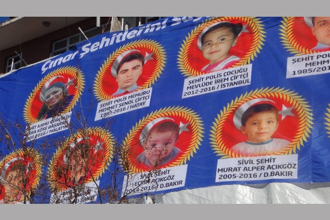 cinar-katliaminda-hayatini-kaybedenlerin-resimleri-emniyet-binasinda-.jpg